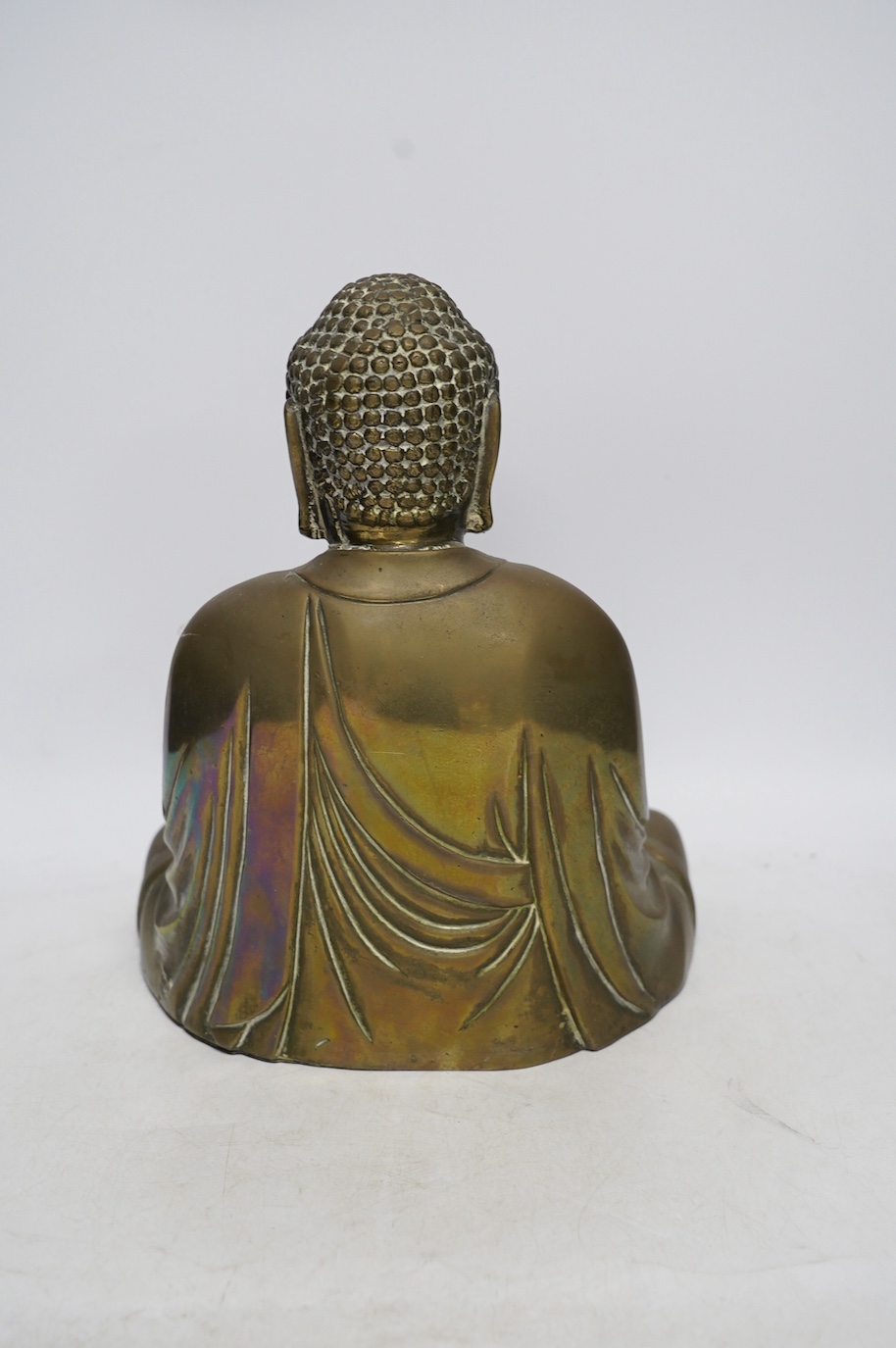 A cast brass figure of Buddha, 27cm high. Condition - fair to good